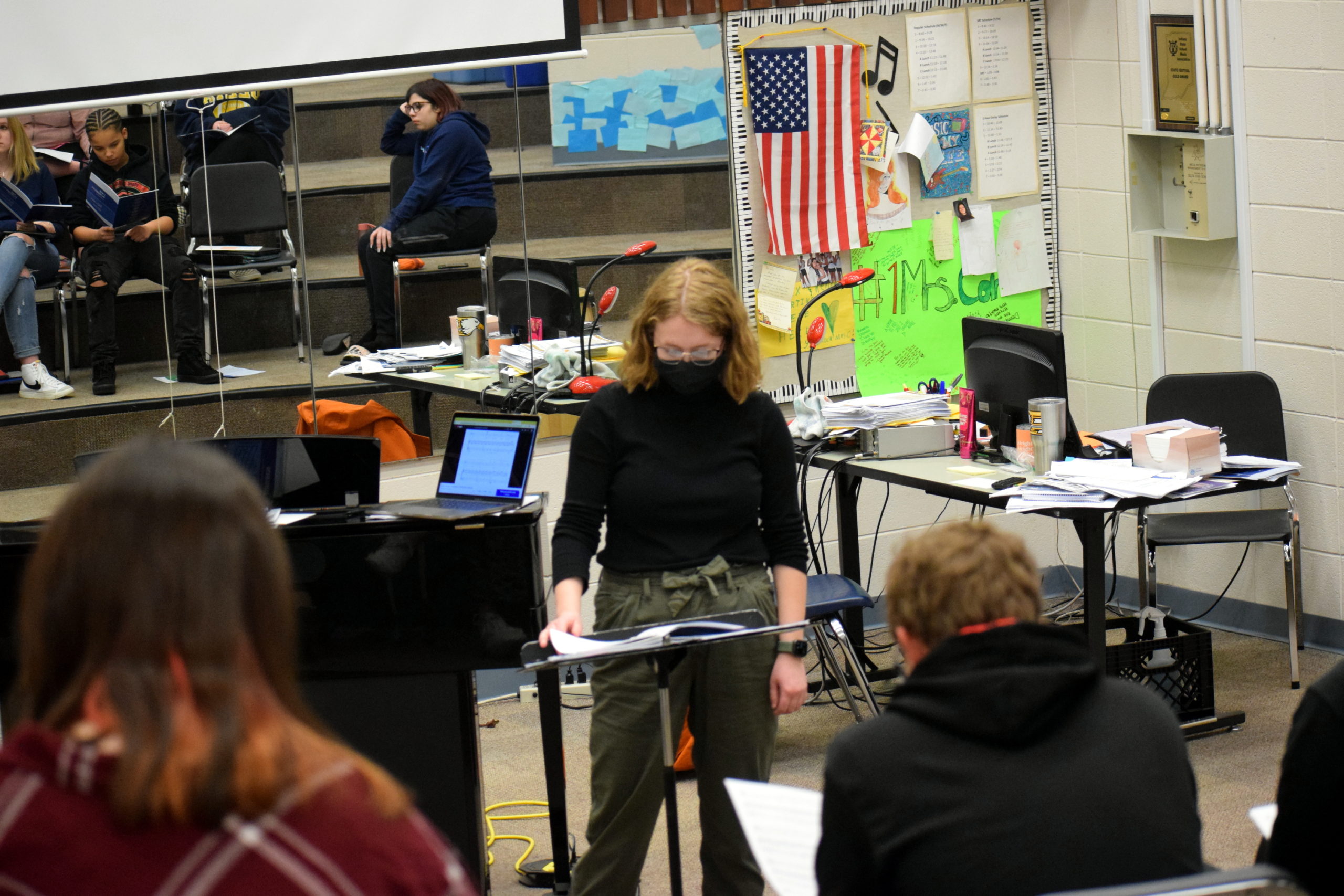 Ms. Grace Arndt teaches music to chorale choir. 