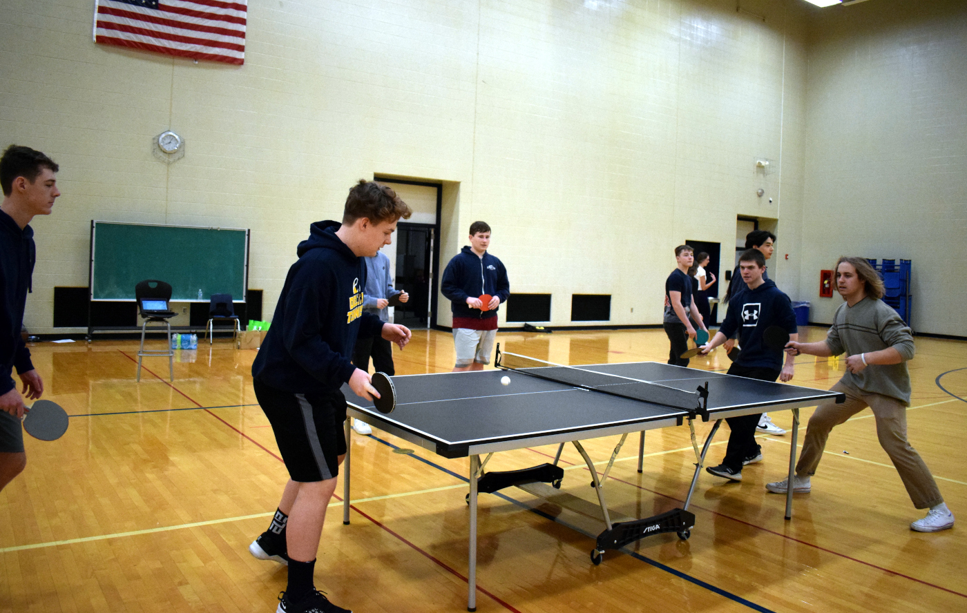 Boys play ping pong