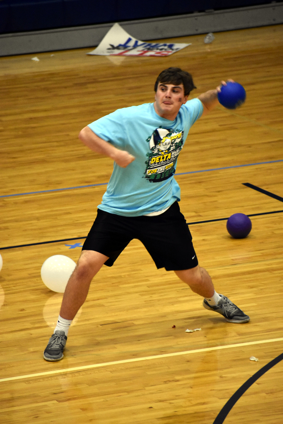 Boy throws dodgeball