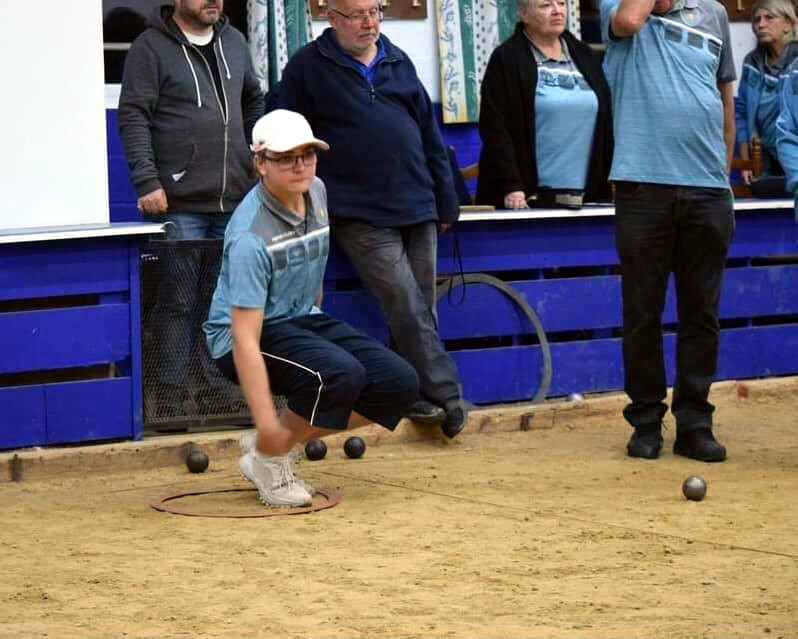 student playing bocce ball