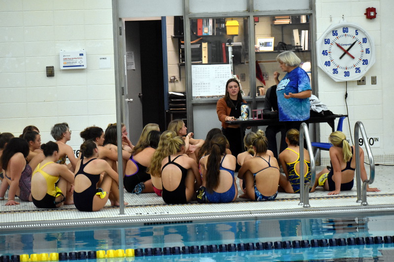 Swimmers with coach