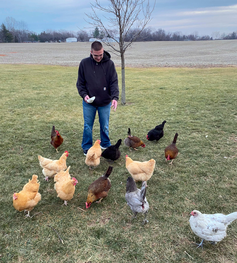 Brandon with Chickens