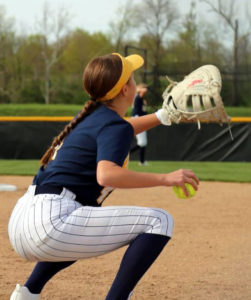 girl throwing a softball