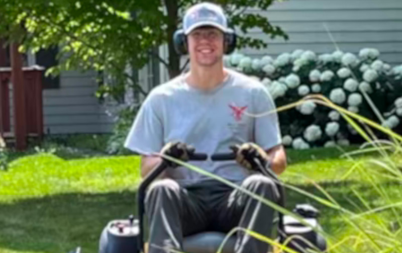 Boy on mower