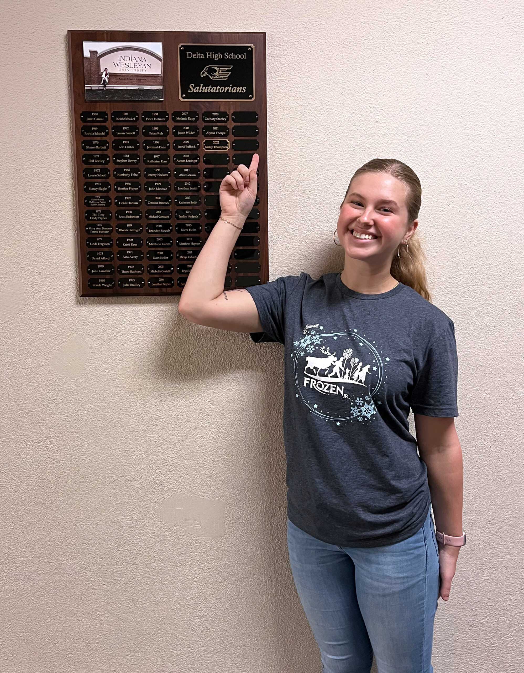 Girl next to plaque