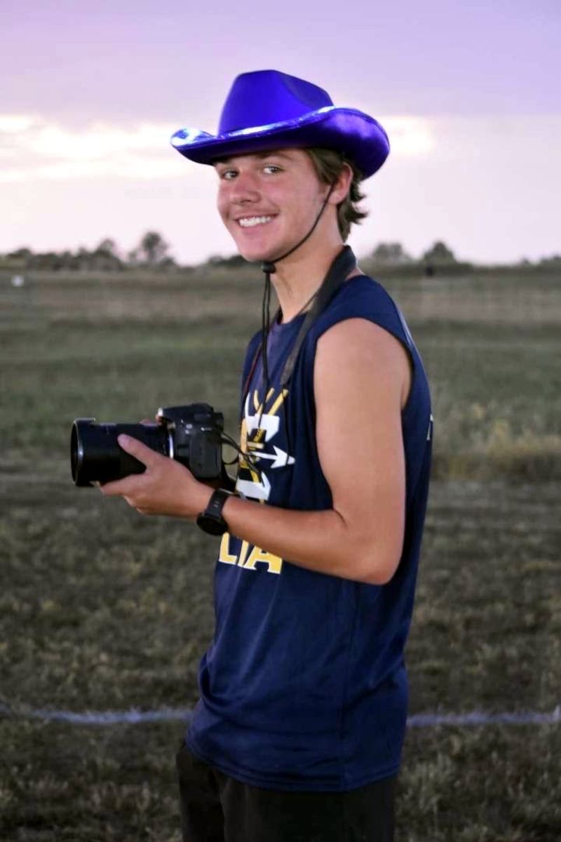 Photographer in cowboy hat