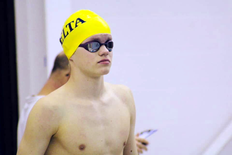 Owen preparing to swim in a meet.