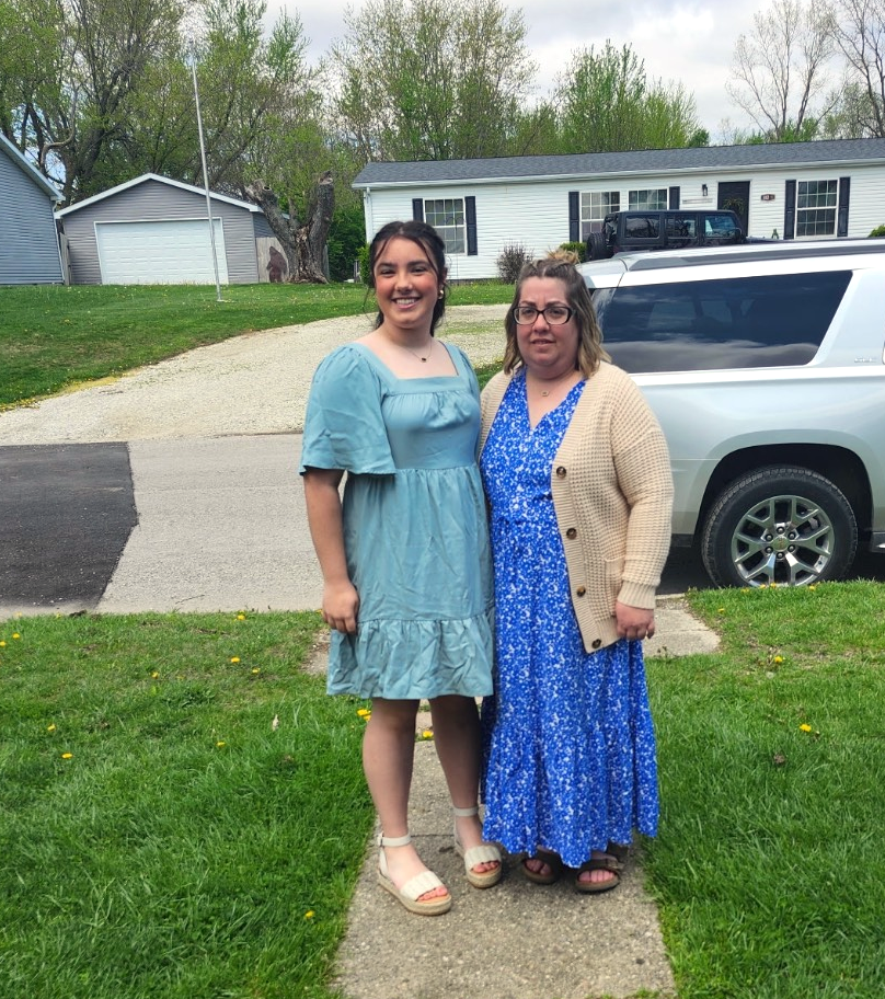 Girl and mom on sidewalk