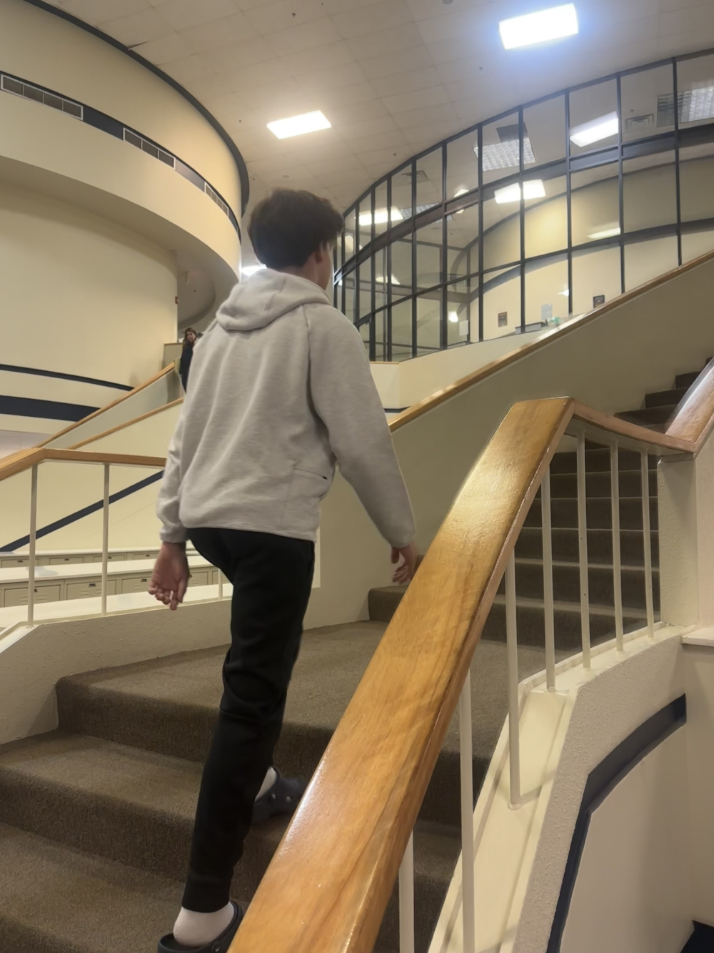 Boy walking up stairs