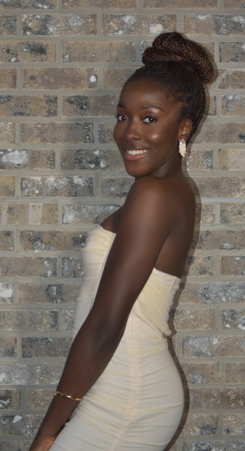 Girl posing against wall